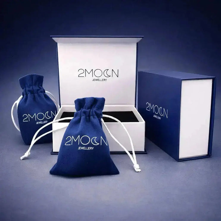 Jewellery packaging set with '2MOON Jewellery' branding on a dark background