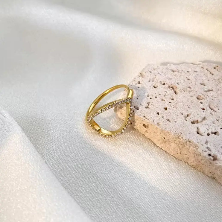 Gold ring on a textured white surface