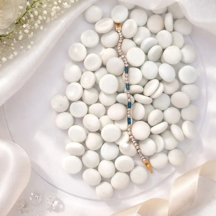 Bracelet with blue stones on a bed of white stones