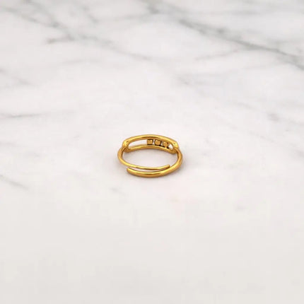 Gold ring on a marble surface