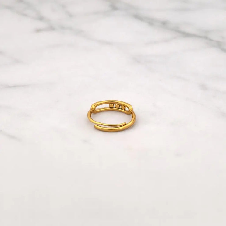 Gold ring on a marble surface