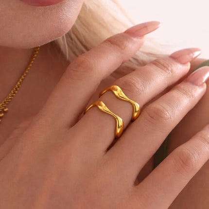 Gold ring on a hand with a soft background