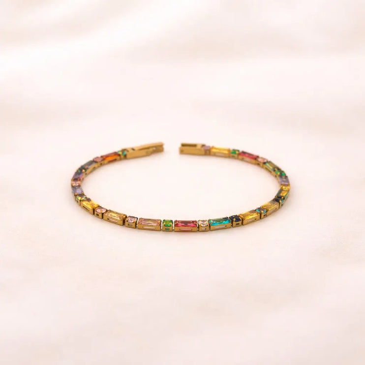 Multicolored beaded headband on a light pink background